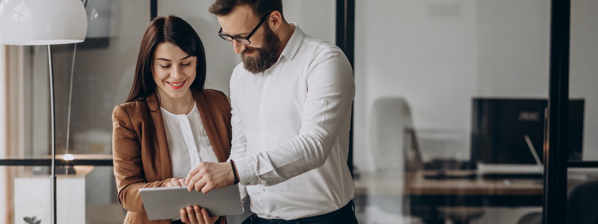 Business partners in an office using a tablet